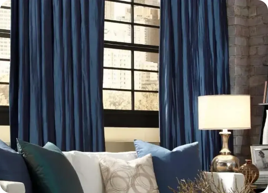 Blue drapery in living room | Lloyd's Carpets & Draperies